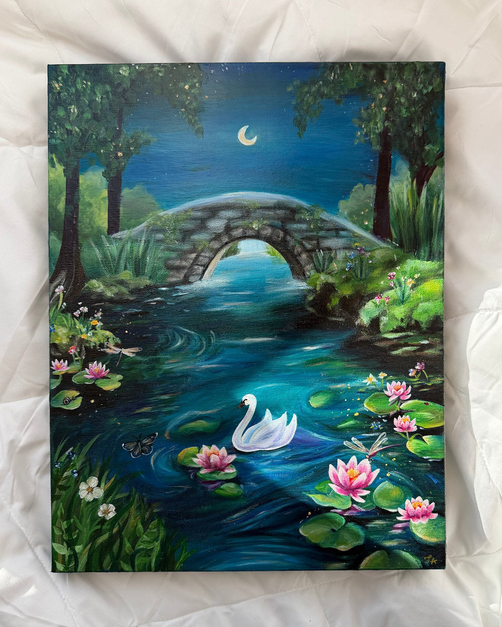 Painting of a serene landscape with a swan, bridge, and flowers on a white surface