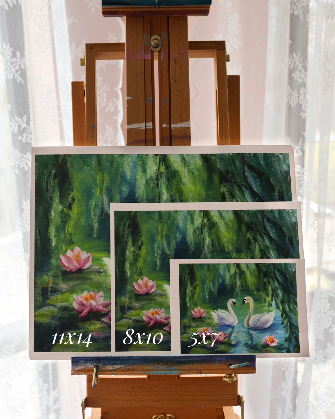 Set of three paintings on an easel with dimensions displayed